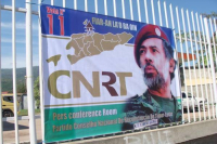 Bandeira CNRT ne'ebe infeita ho retratu Prezidente Partidu nian